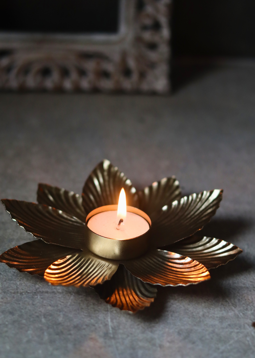 Golden tea light holder for home decoration