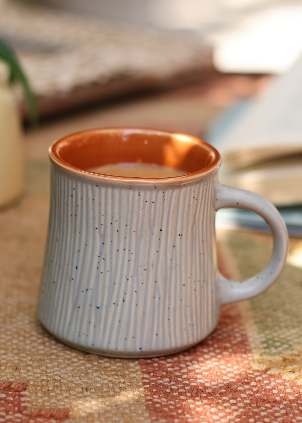 Grey etching chai cup with tea 