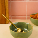 pistachio stoneware bowl with dinner spoon