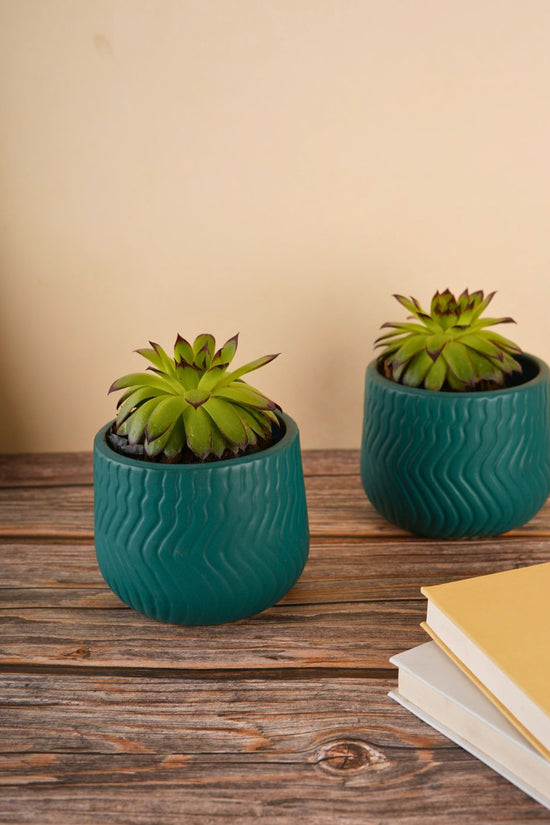 essential teal planter with teal color