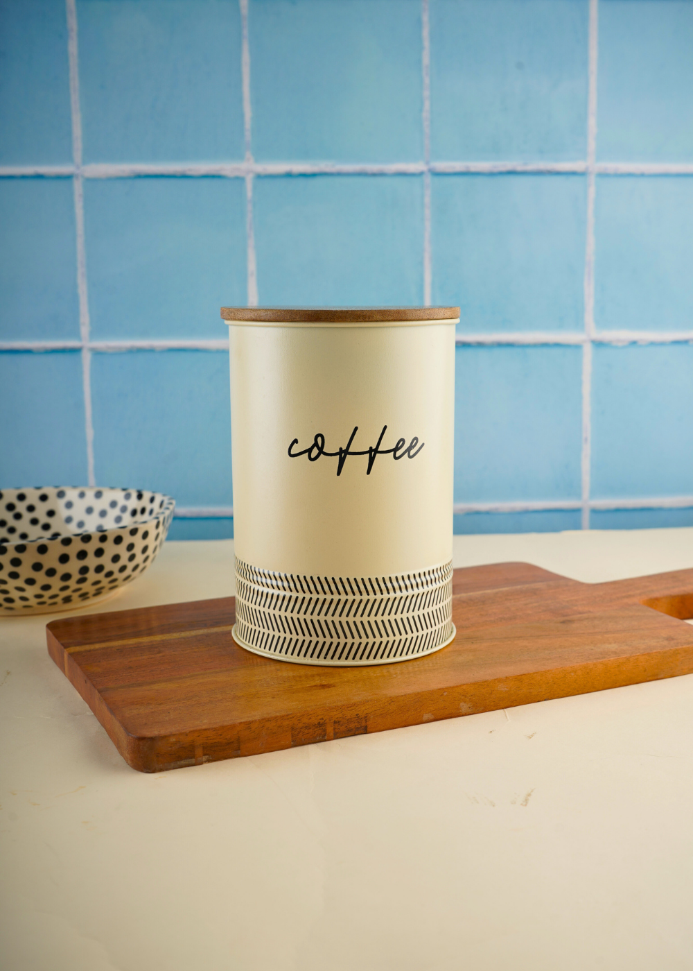 White & black coffee jar on wooden surface