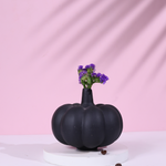 black pumpkin bud vase made by ceramic 