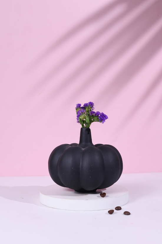 black pumpkin bud vase made by ceramic 