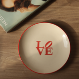 Love snack plate on wooden surface 