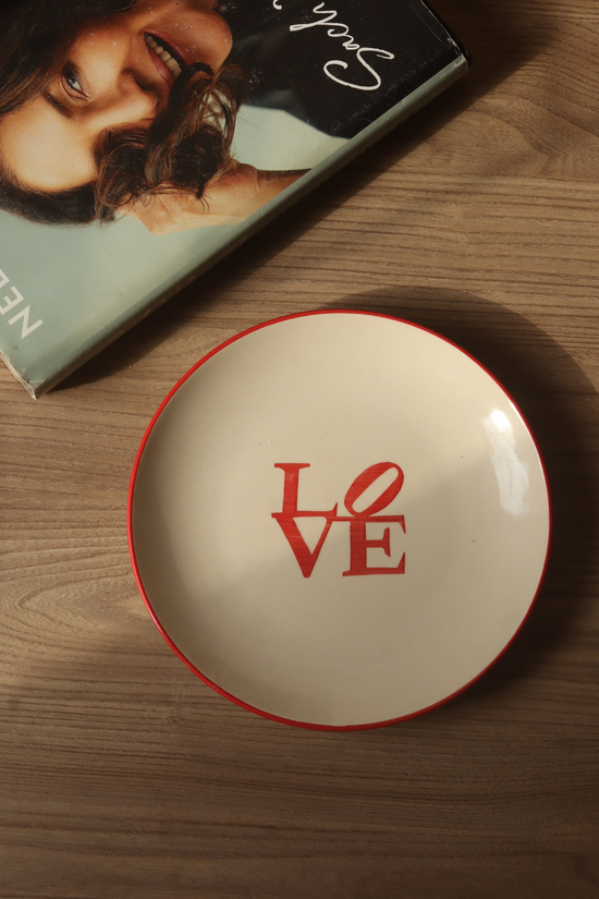 Love snack plate on wooden surface 