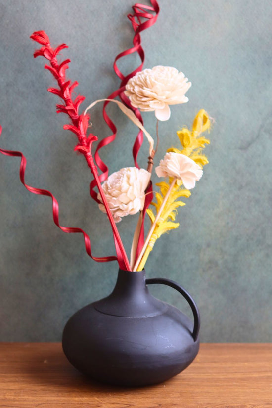 this vase with adorable flower bunch made with premium quality material