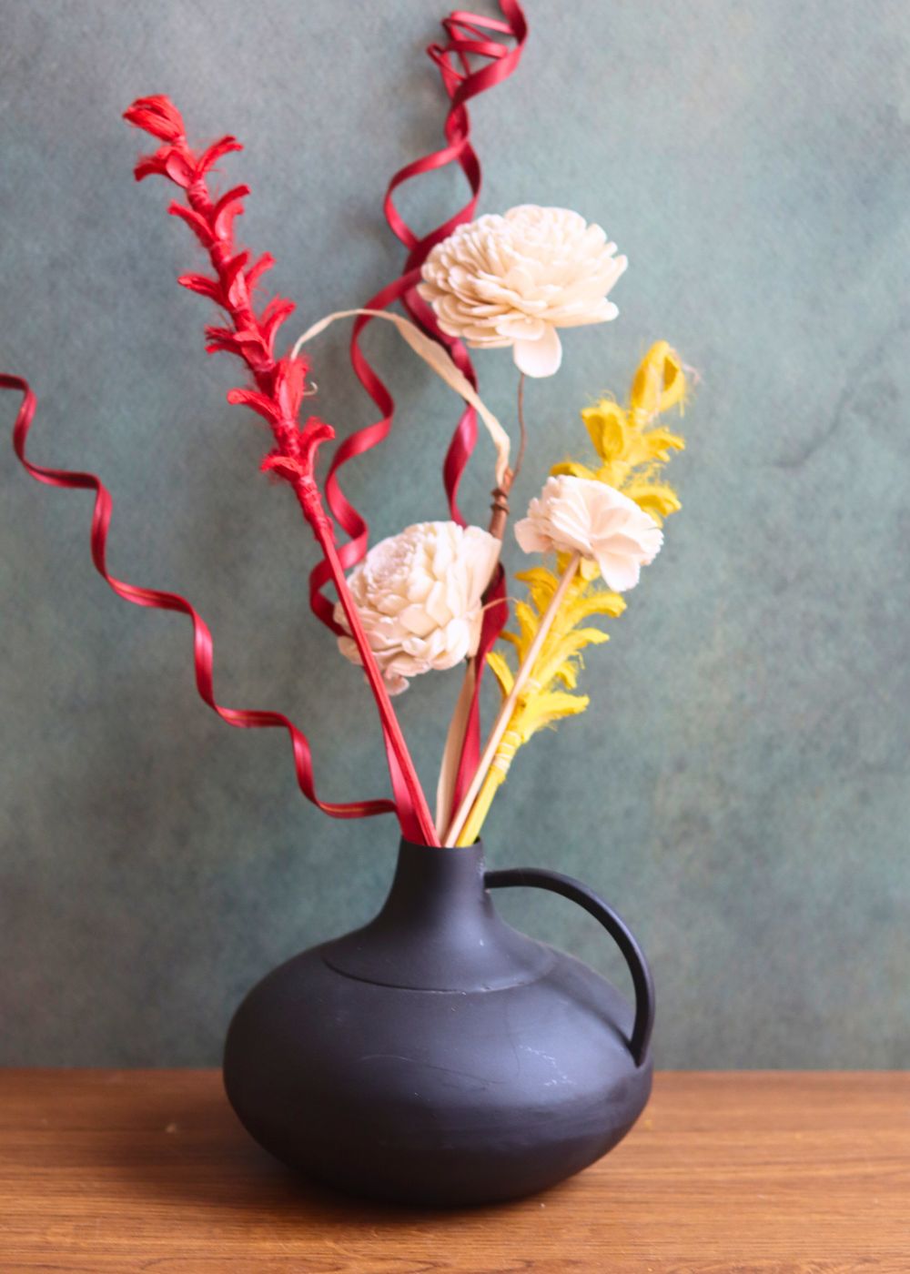 this vase with adorable flower bunch made with premium quality material
