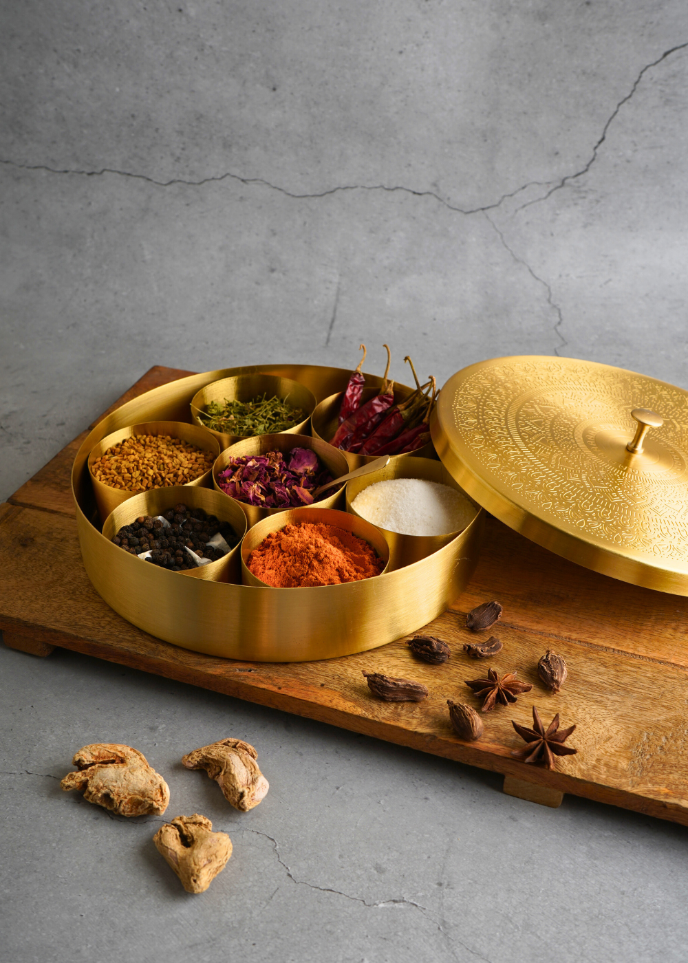 Brass spices box with spices in it