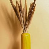 Dried natural bajra bunch in yellow vase