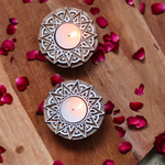 Wooden candle holders with flower petals 