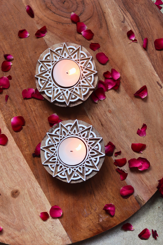 Wooden candle holders with flower petals 