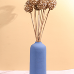 Jute balls bunch in blue vase