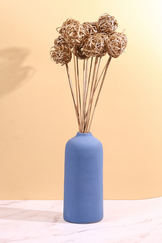 Jute balls bunch in blue vase