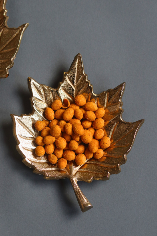 Golden leaf patterened bowl with snacks