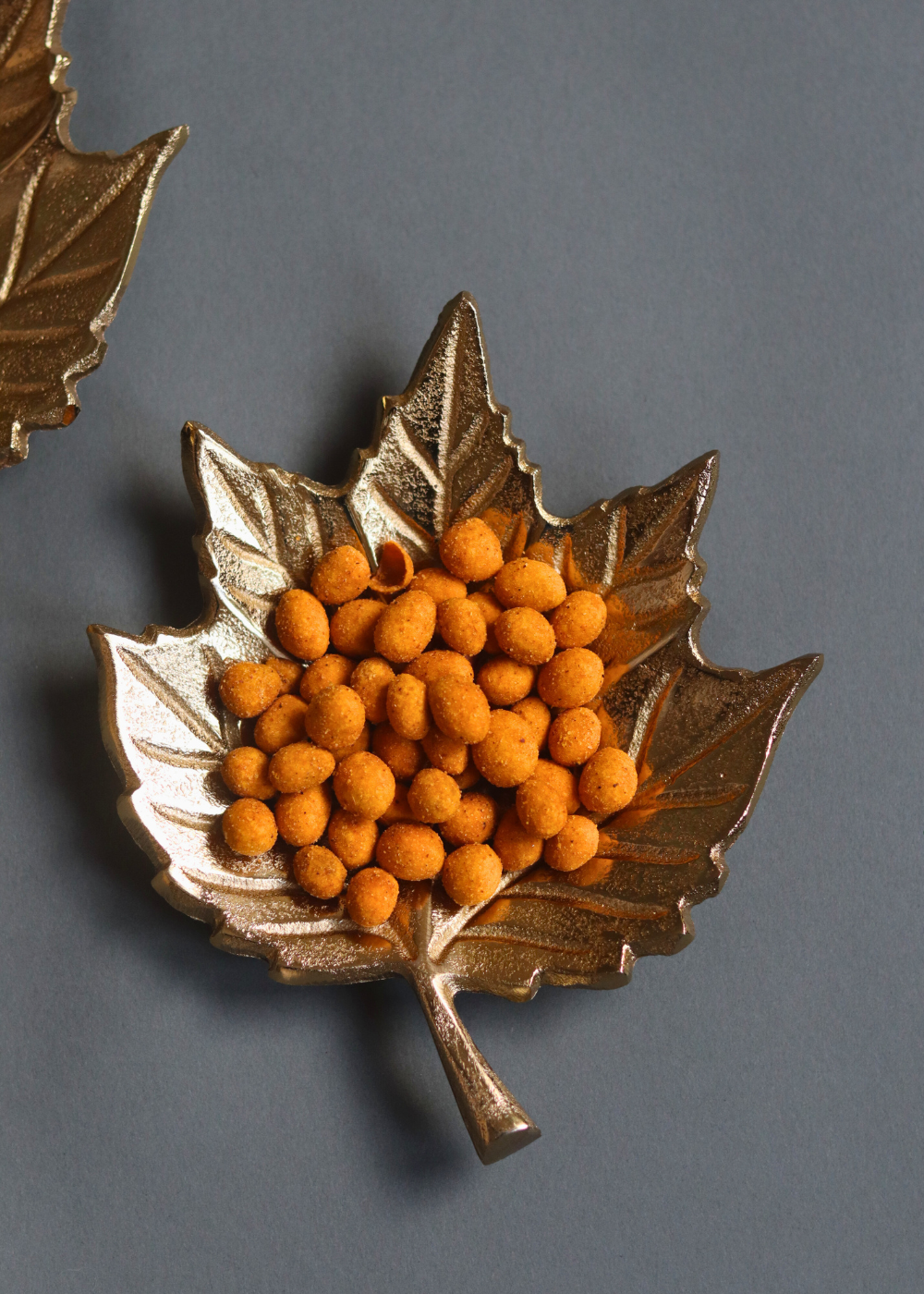 Golden leaf patterened bowl with snacks