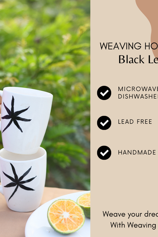 White mug with black leaf print