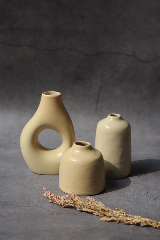 set of three cream vases made by ceramic 