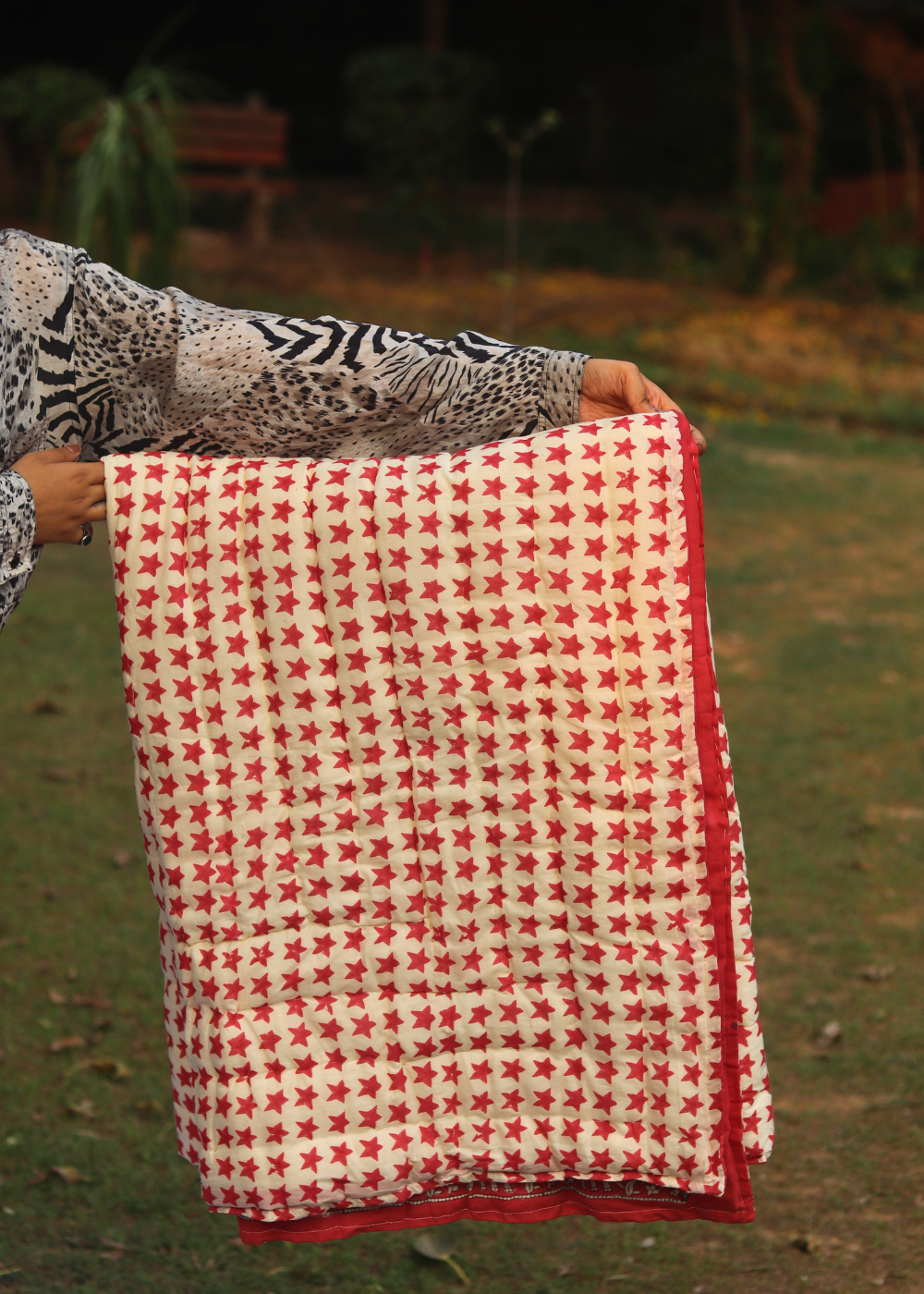 red stars blanket in hand
