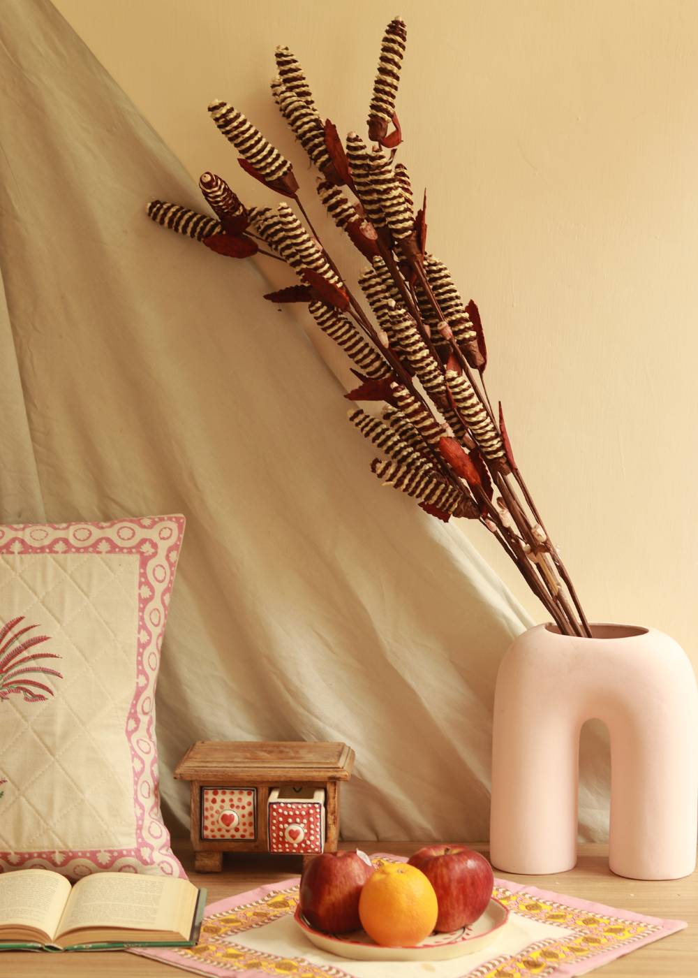 Dried pine chain flower bunch in vase