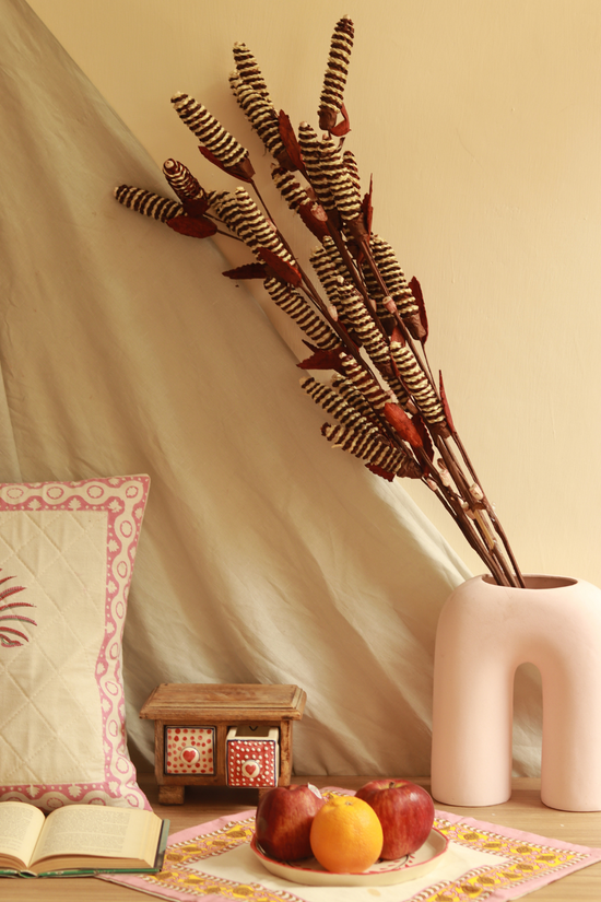 Dried pine chain flower bunch in vase