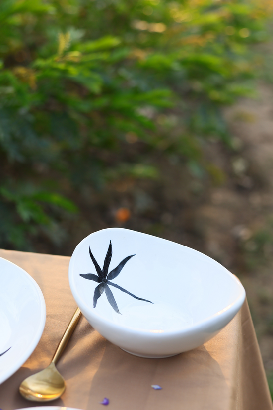 White bowl with black leaf print