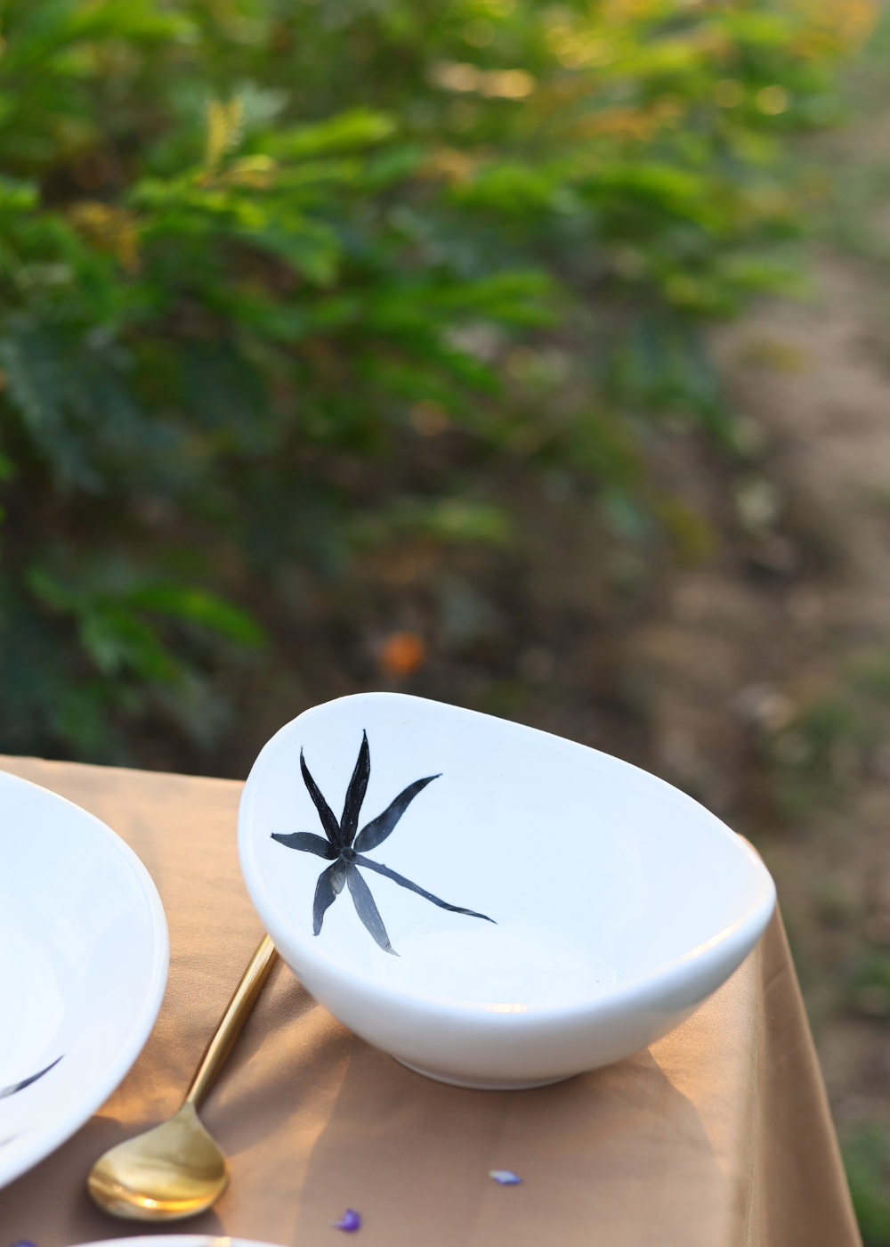 White bowl with black leaf print