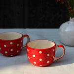 Two handmade ceramic red & white coffee mugs 