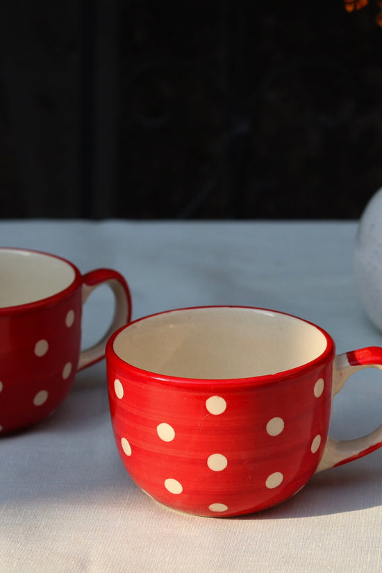 Two handmade ceramic red & white coffee mugs 