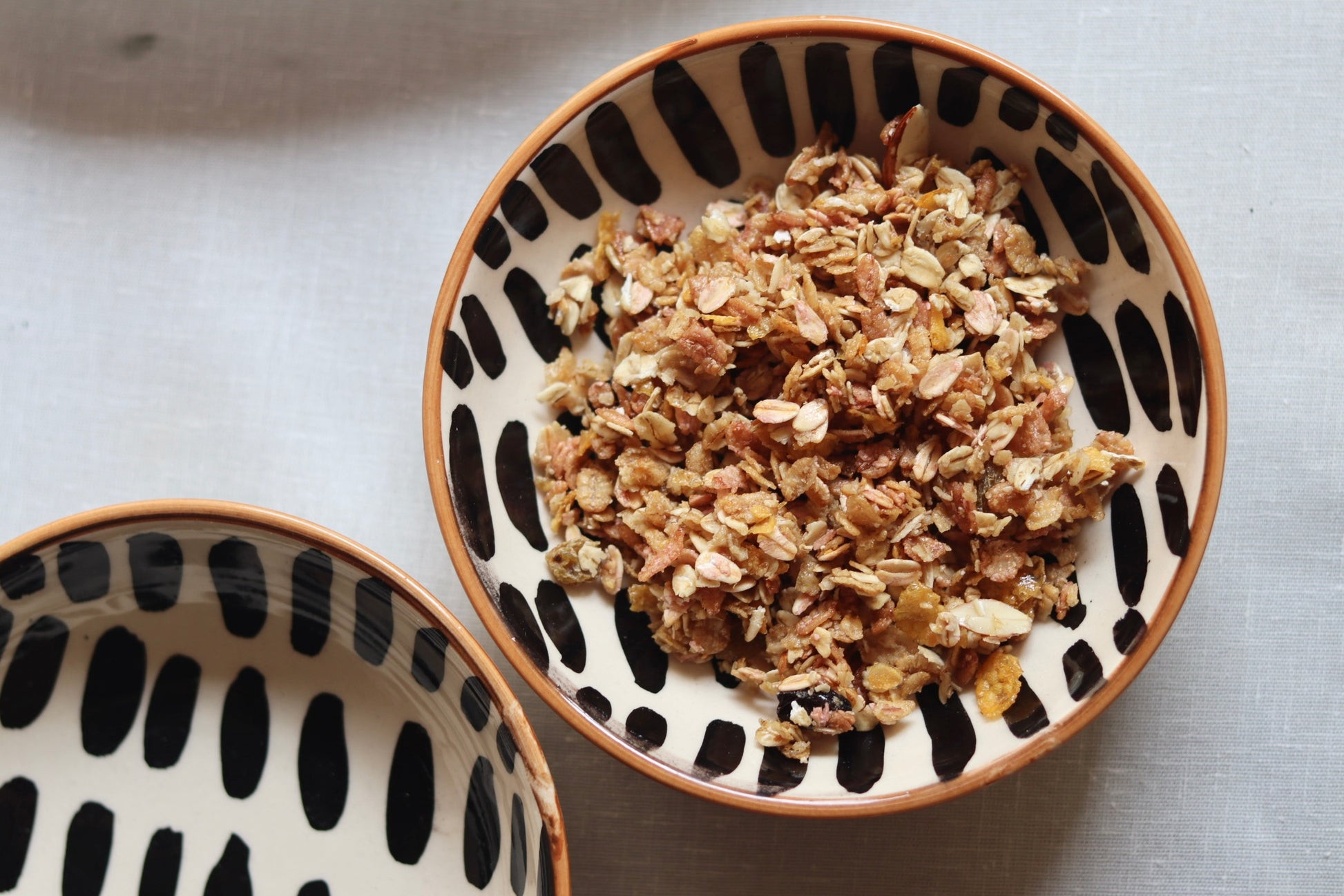 handmade striped cereal bowl with delicious dessert