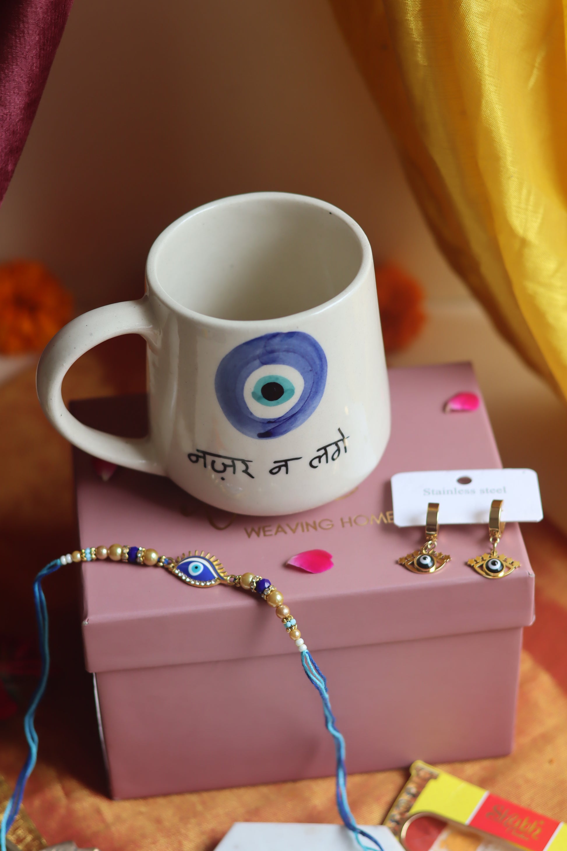 Rakhi Nazar Mug gift box with Rakhi & Earrings