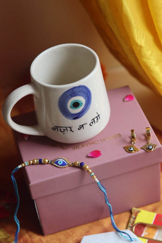 Rakhi Nazar Mug gift box with Rakhi & Earrings