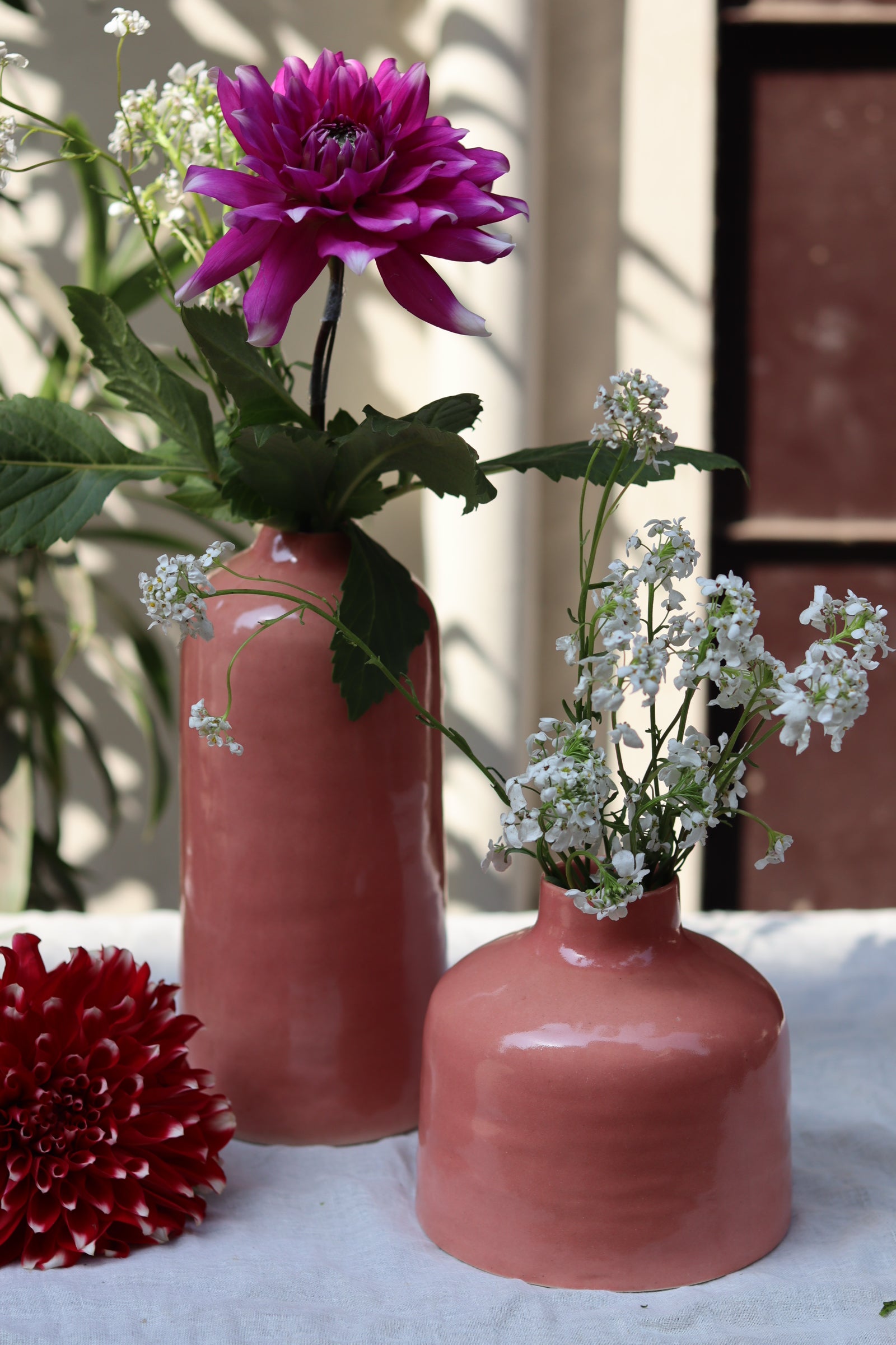 Handmade ceramic two pink vases with flowers