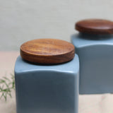 Grey square jars with wooden lid