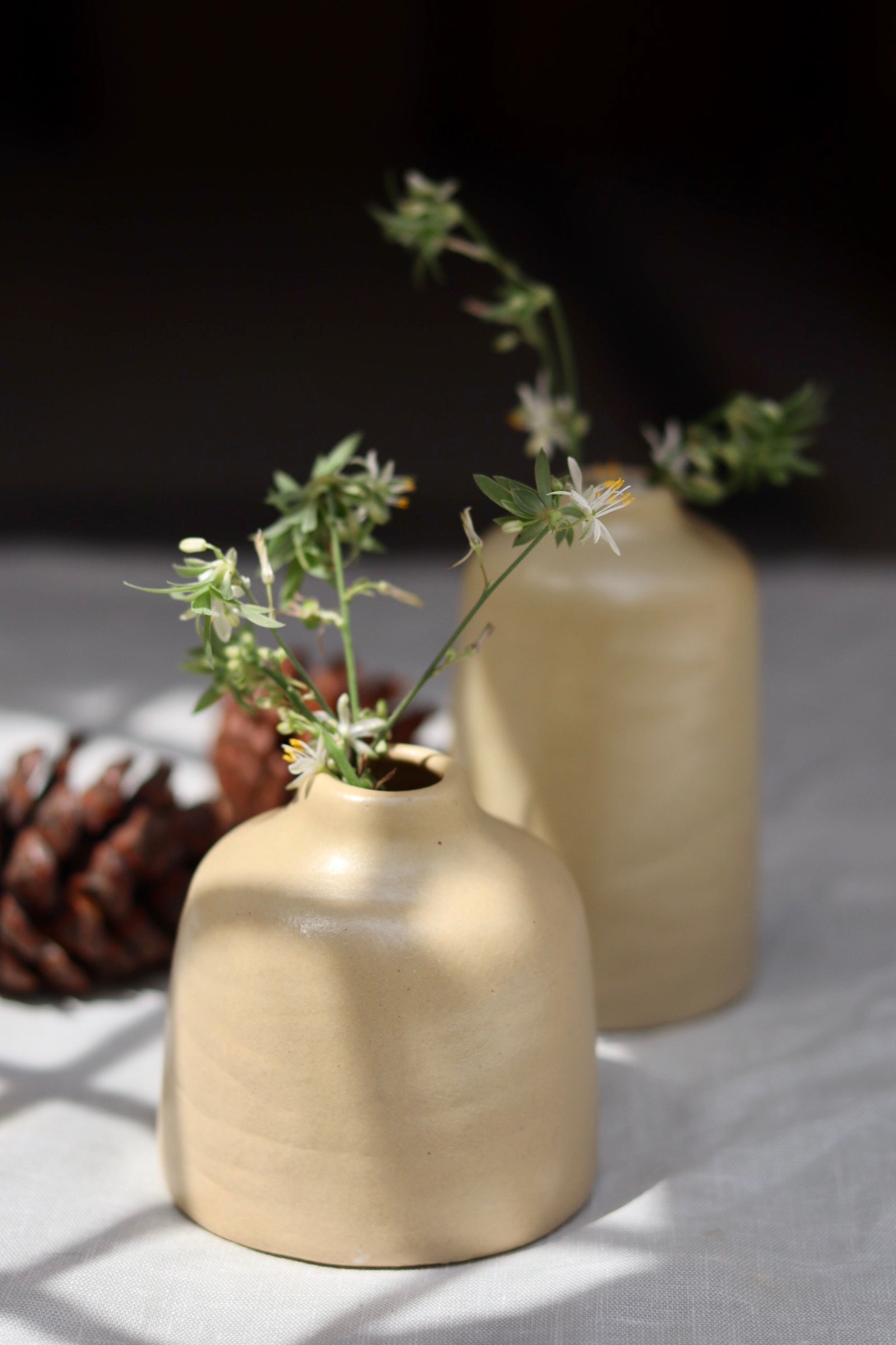 handmade cream bud vases made by ceramic 
