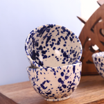 Blue flecked bowls on each other