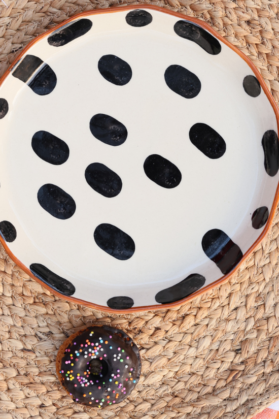 handmade black block snack plate with yummy snack