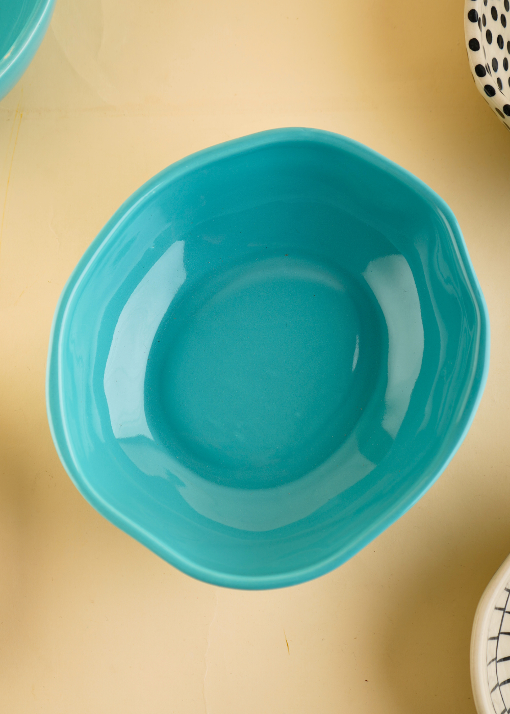 Basic teal bowl on a plain surface