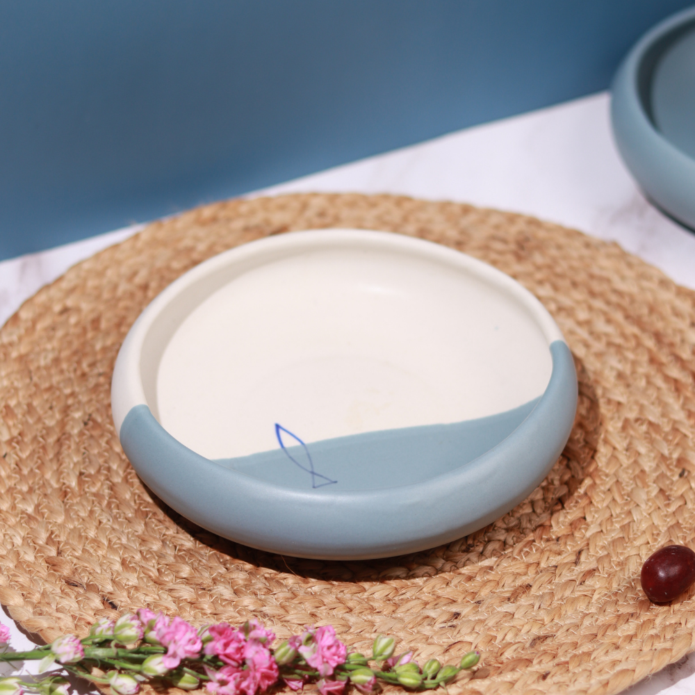 Handmade ceramic bowl on mat