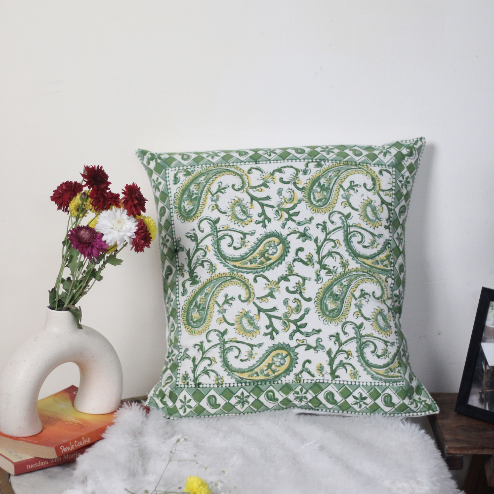 Green paisley cushion cover on chair