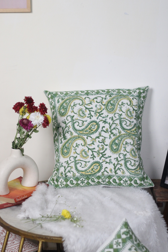 Green paisley cushion cover on chair