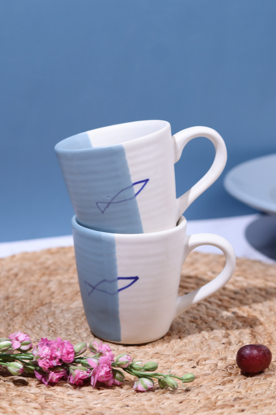 Coastal catchy coffee mug on mat