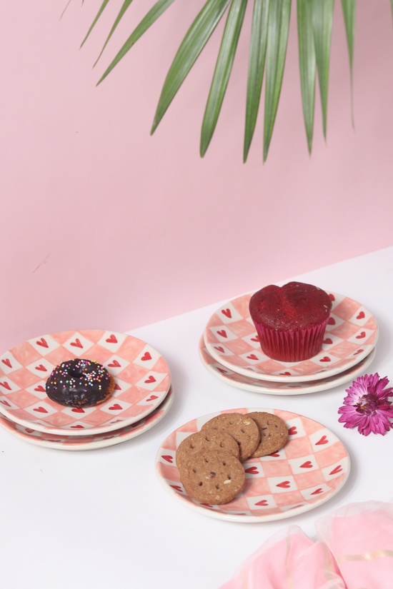 Chequered heart plates with snacks