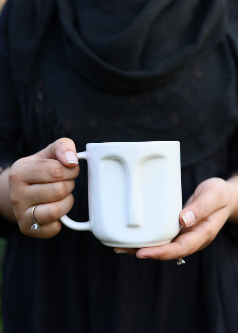 Drinkware handmade white face coffee mug in hand