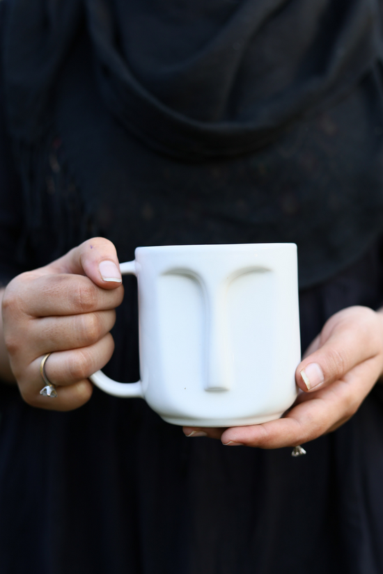 Drinkware handmade white face coffee mug in hand