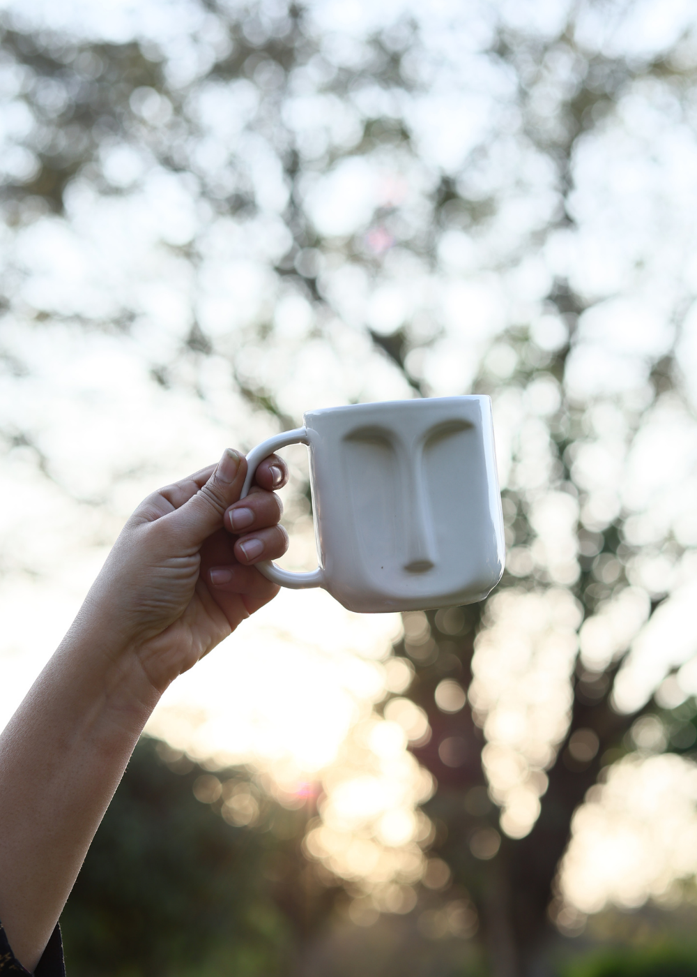 Drinkware coffee mug in hand