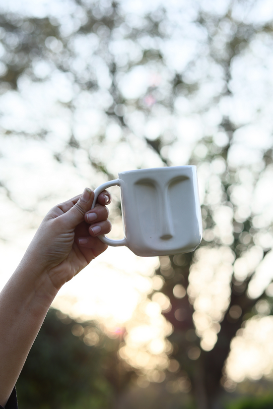 Drinkware coffee mug in hand