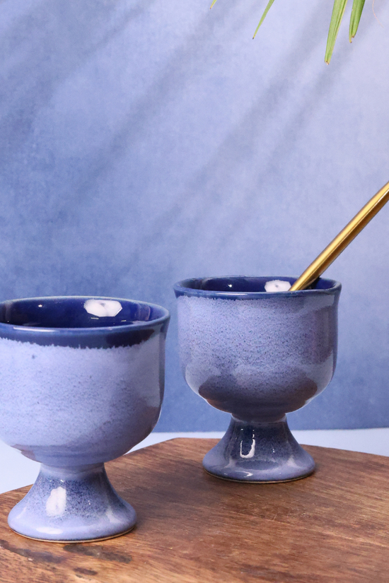 Blue icecream goblet on wooden surface