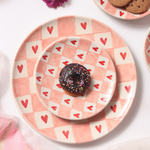 Chequered heart dinner plates with donut 