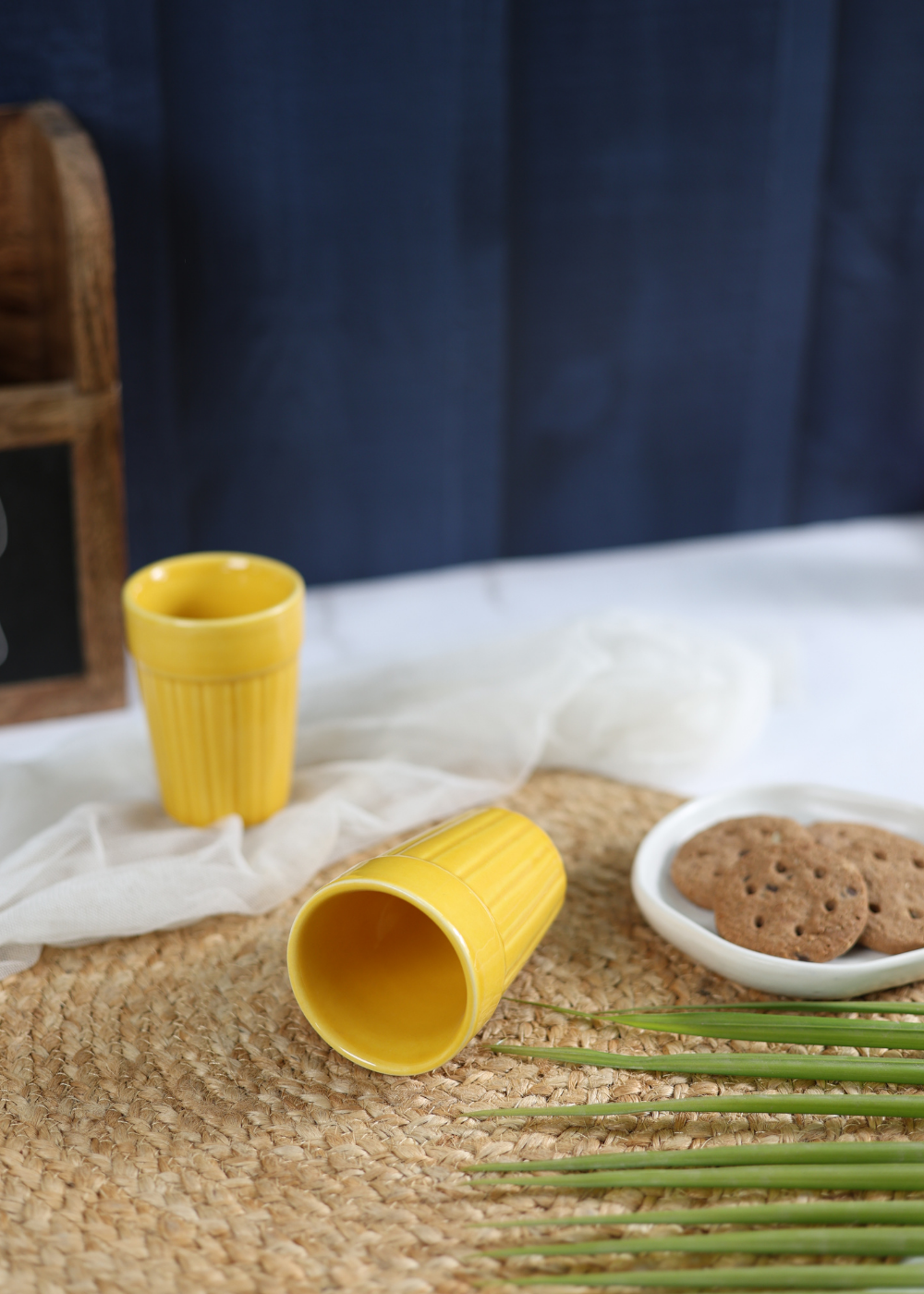 Yellow handmade kulhads with cookies