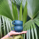 Matte green chai cups in hand 